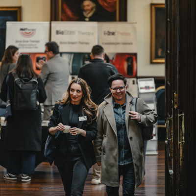 Two people attending the Podiatric Medicine annual conference