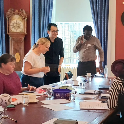 A group discussing things round a table