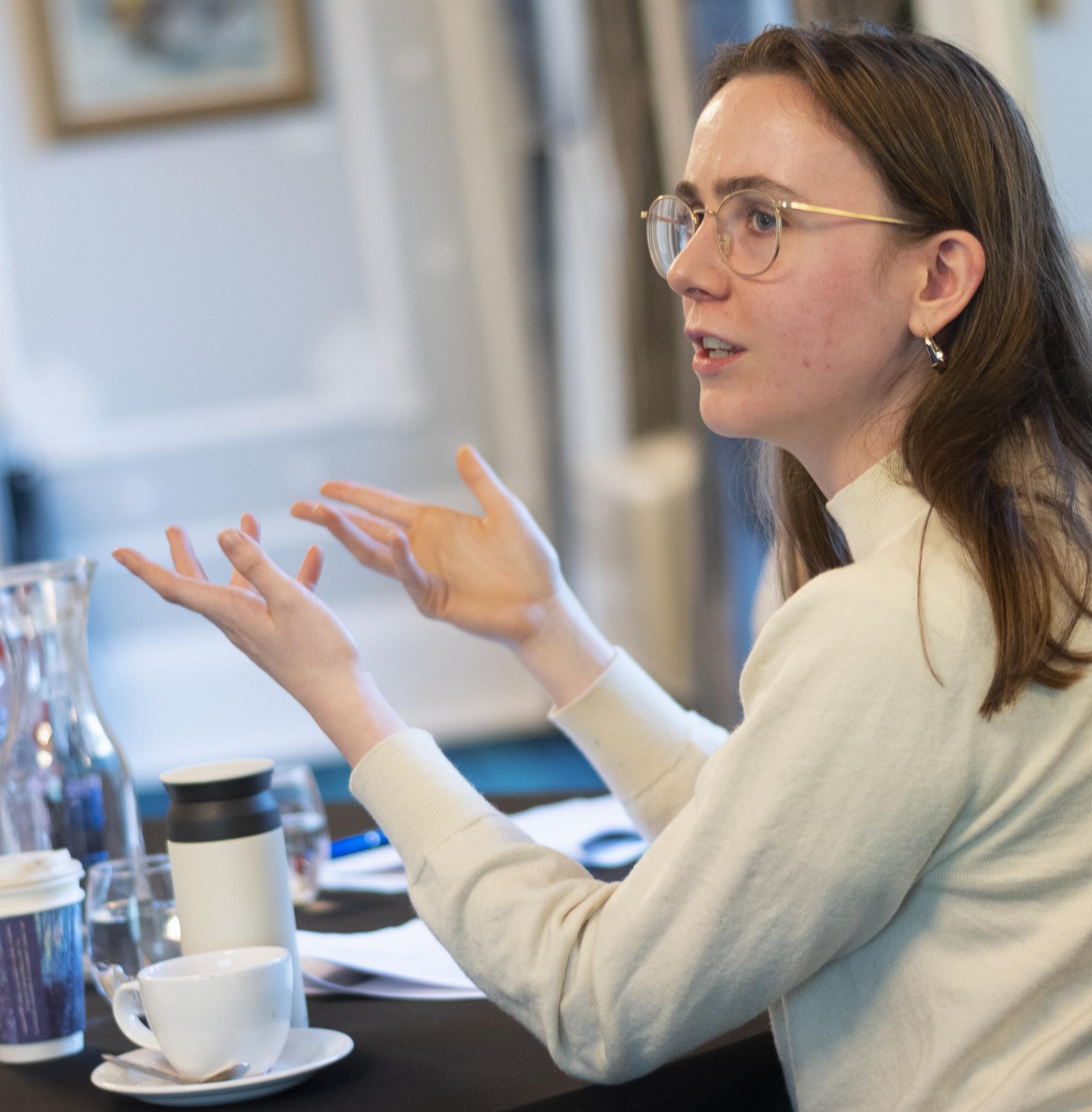 A woman discussing in a group