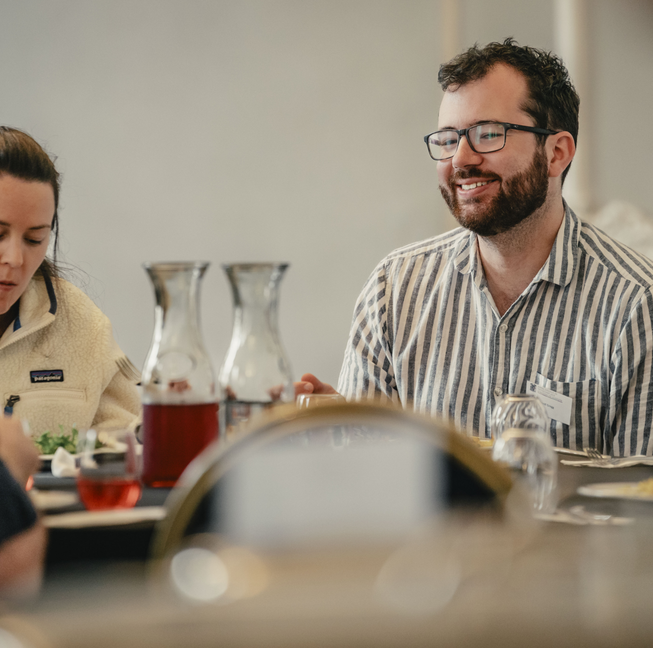 A man smiling and laughing