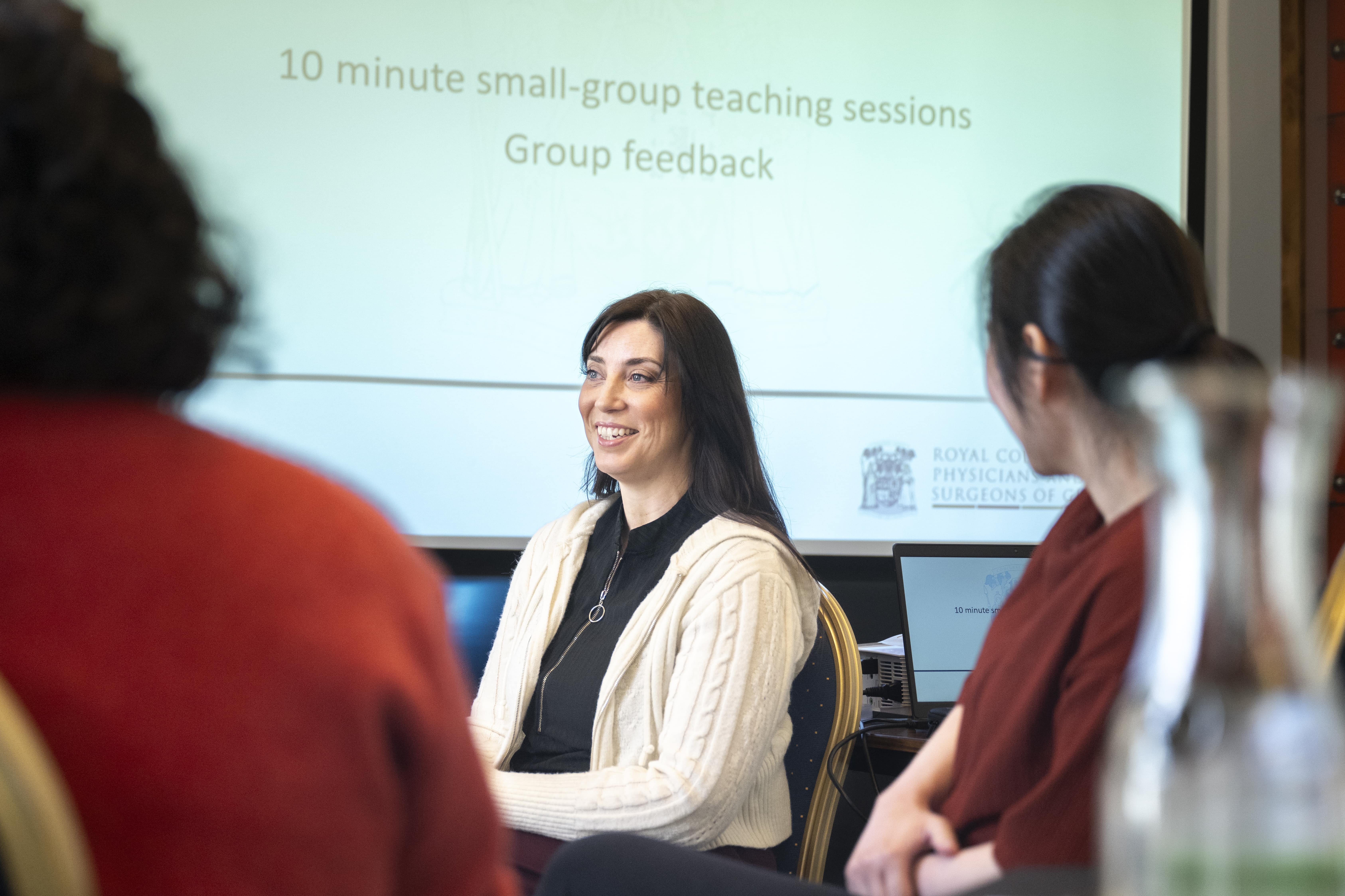 a group discussion with people smiling and laughing