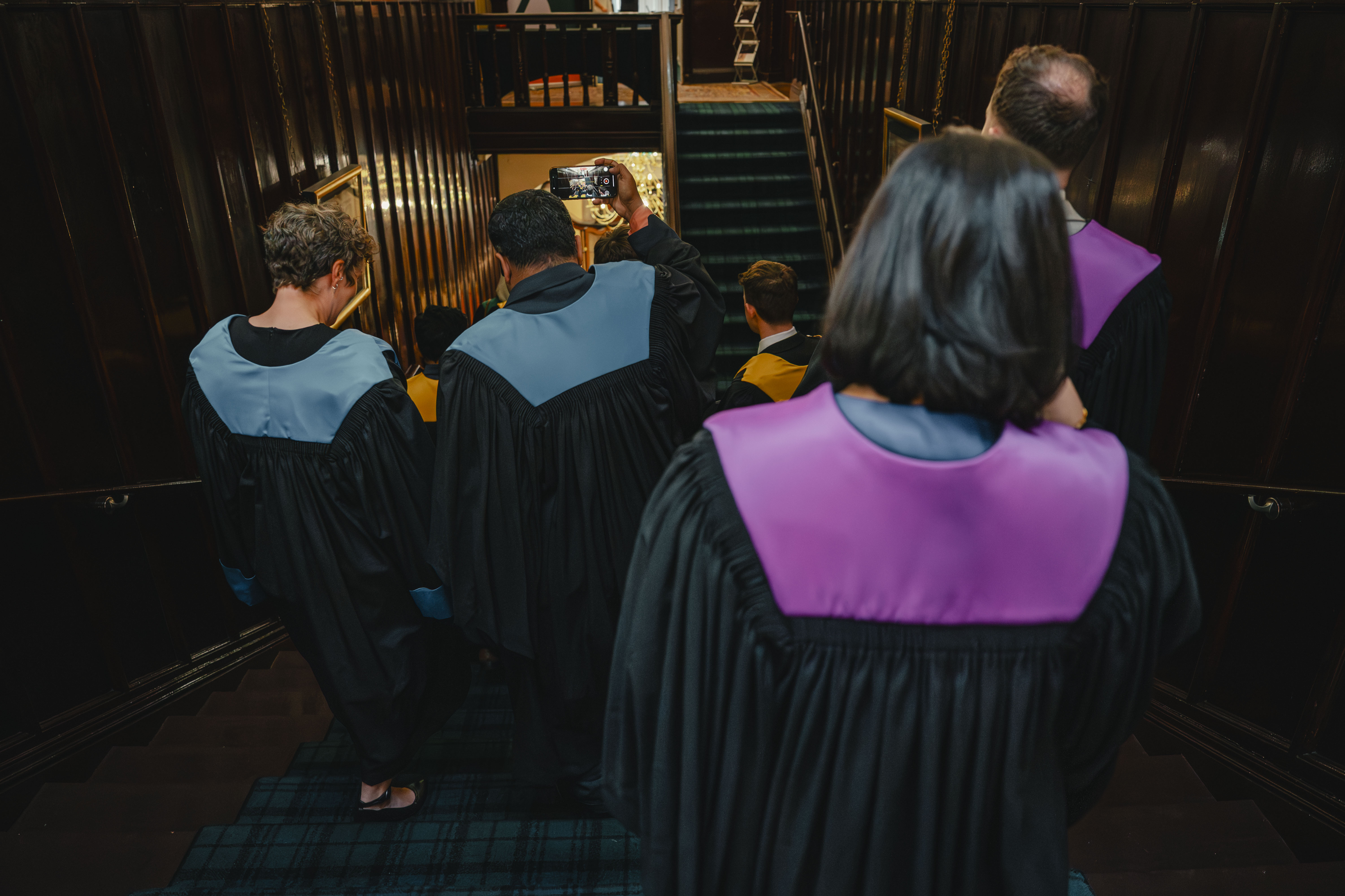 a group in blue and purple ceremonial robes