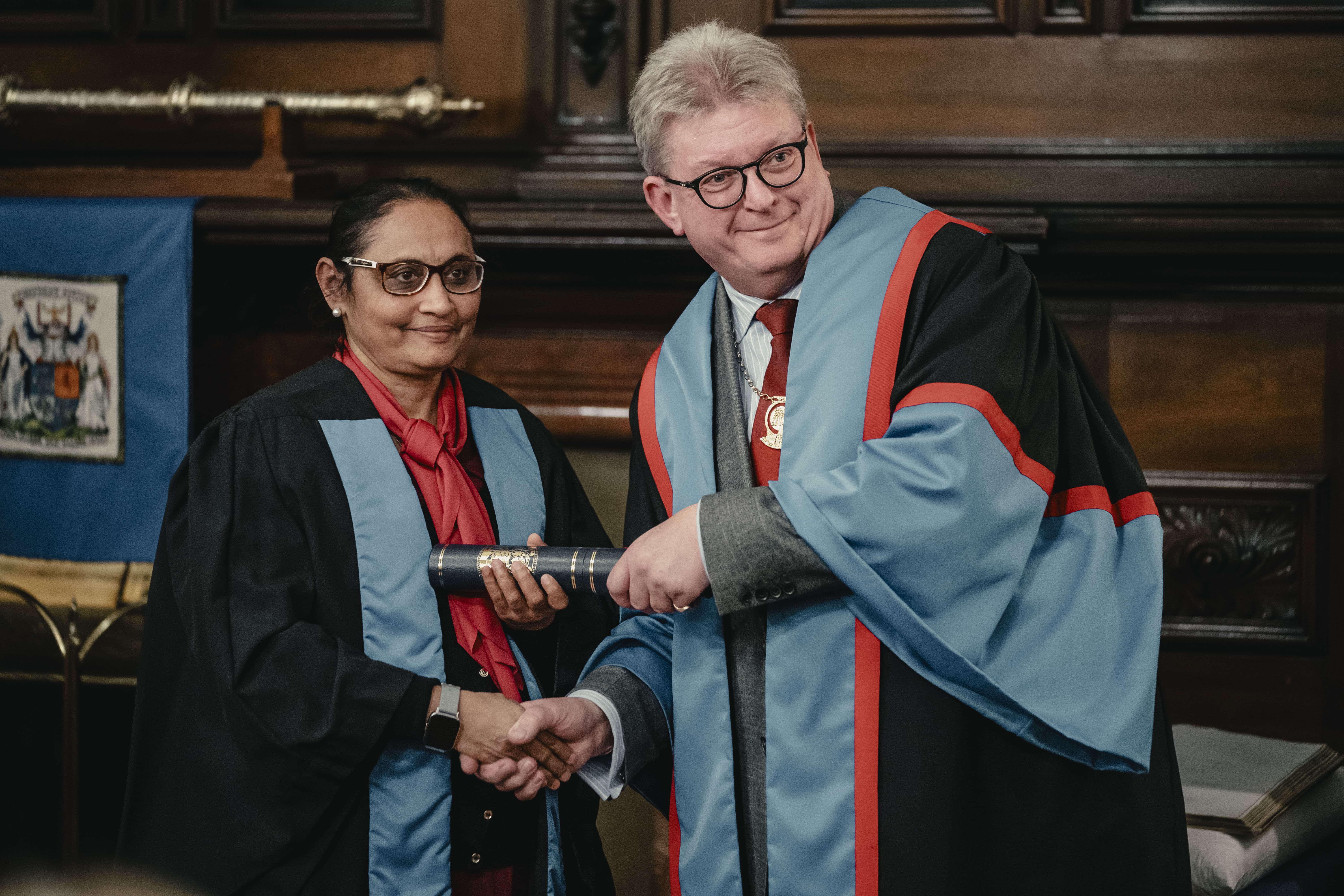 a travel medicine graduate receives their diploma