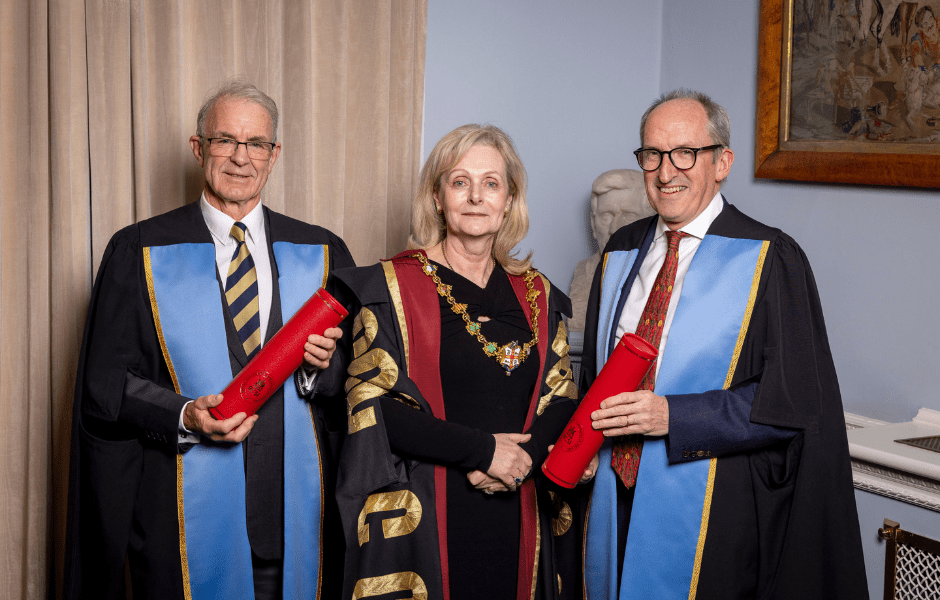 Mike McKirdy, right, with Professor Laura Viani, centre, and Honorary Fellow John Matheson, left.
